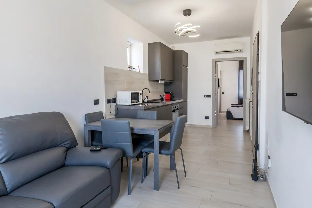 Attico Bicocca, Wohnzimmer mit Küche 2 — Apartment in Bicocca, Mailand