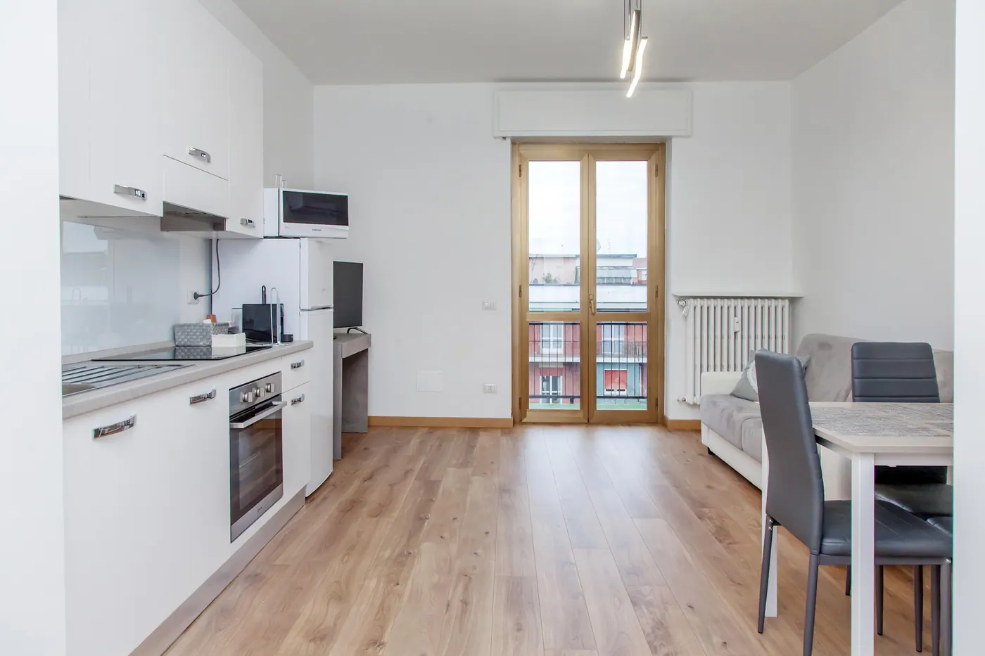 Casa Savoldo, soggiorno con cucina 2 — appartamento a Bicocca, Milano